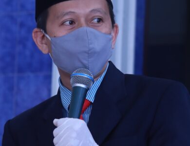 man in black suit jacket holding microphone