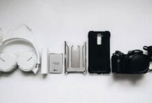 white Sony headphones and black smartphone case